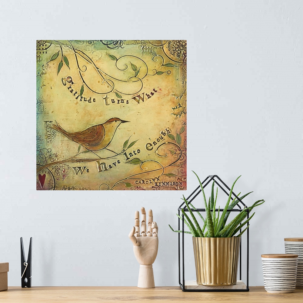 A bohemian room featuring An inspirational sentiment over a painting of a bird on curly branches.