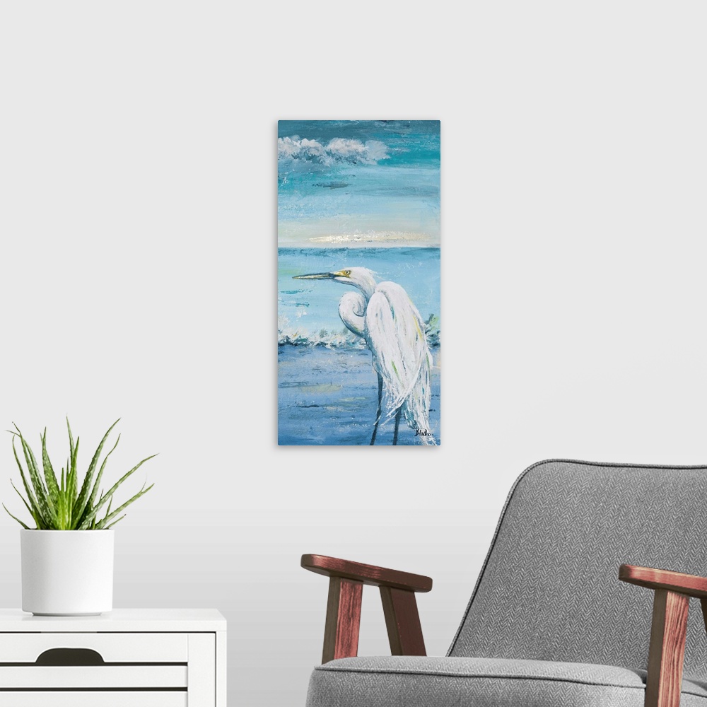 A modern room featuring Contemporary painting of a white egret overlooking the blue water.
