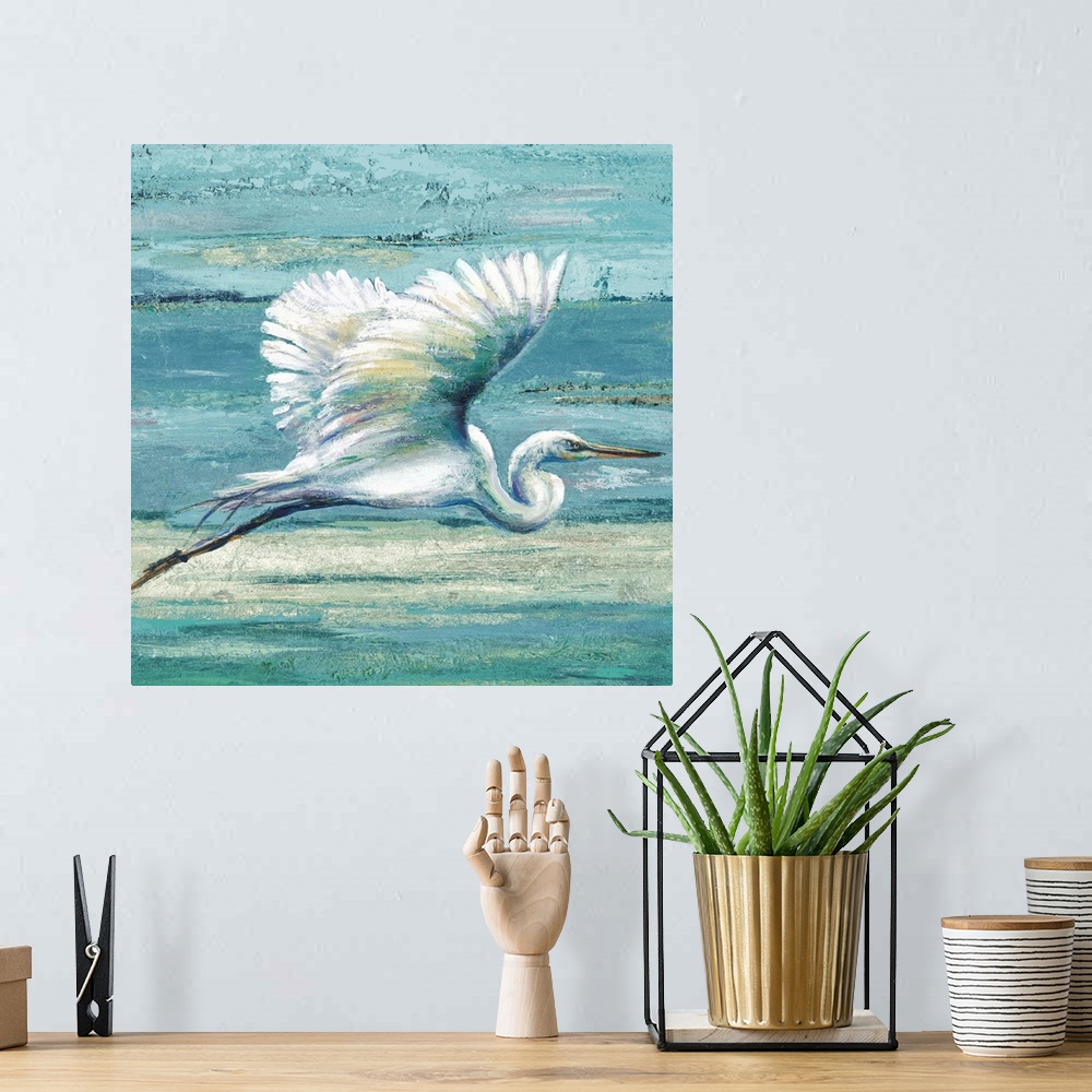 A bohemian room featuring Contemporary painting of a white egret in flight against a blue abstract background.