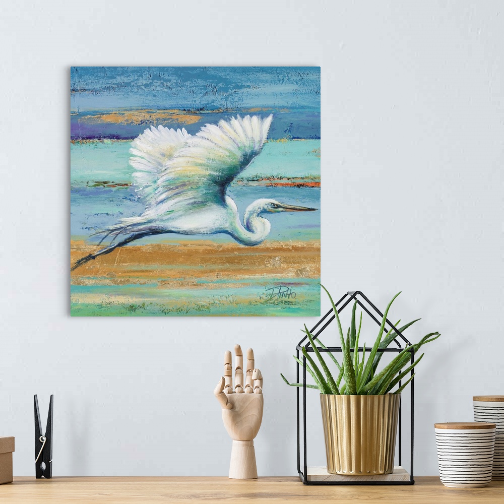 A bohemian room featuring Contemporary painting of a white egret in flight against a blue and green abstract background.