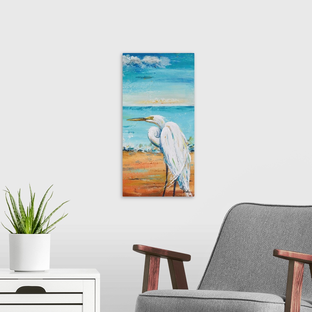 A modern room featuring Contemporary painting of a white egret standing on a sand beach with the ocean in the background.