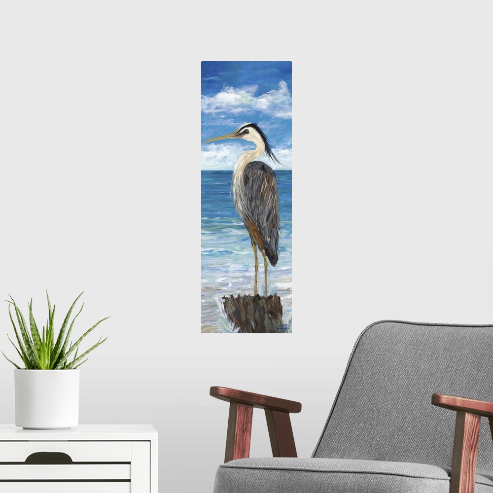 A modern room featuring A Great Blue Heron standing on a post, overlooking the water.