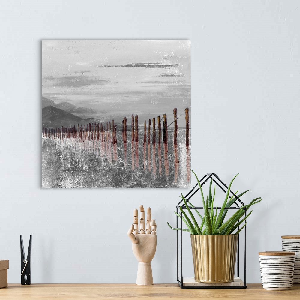 A bohemian room featuring Square abstract painting of brown pier remains  in gray and white textured water with mountains i...