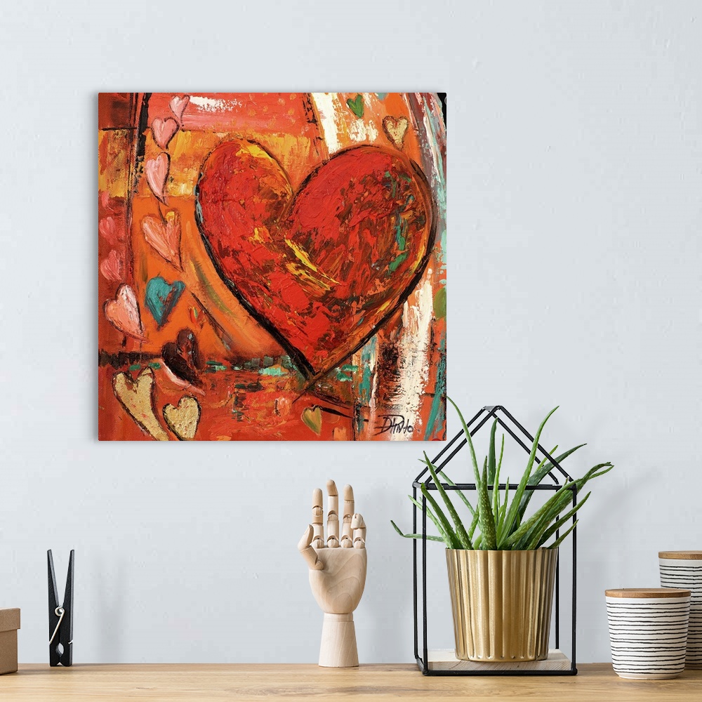 A bohemian room featuring Painting of a large red heart with several smaller hearts around it.
