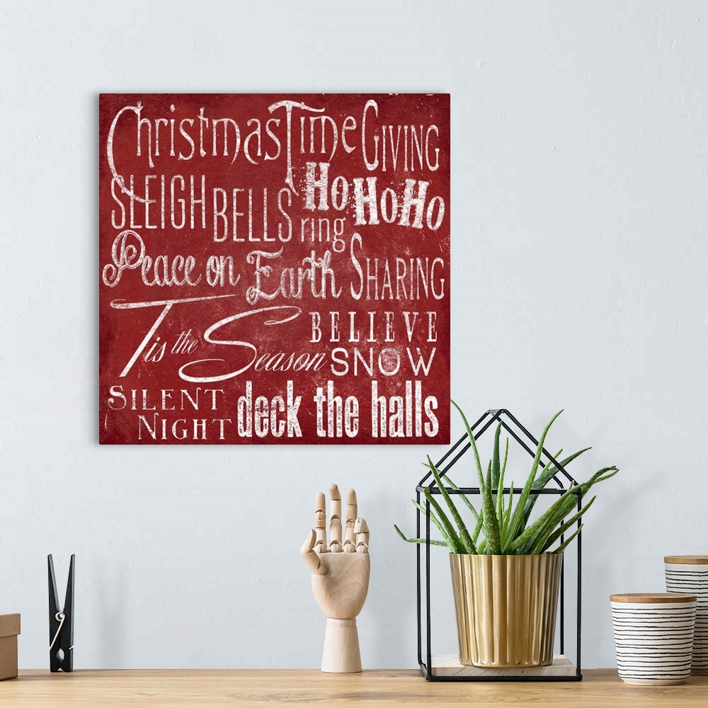 A bohemian room featuring Typography panel of Christmas-themed text, including carol lyrics and festive themes such as "Pea...