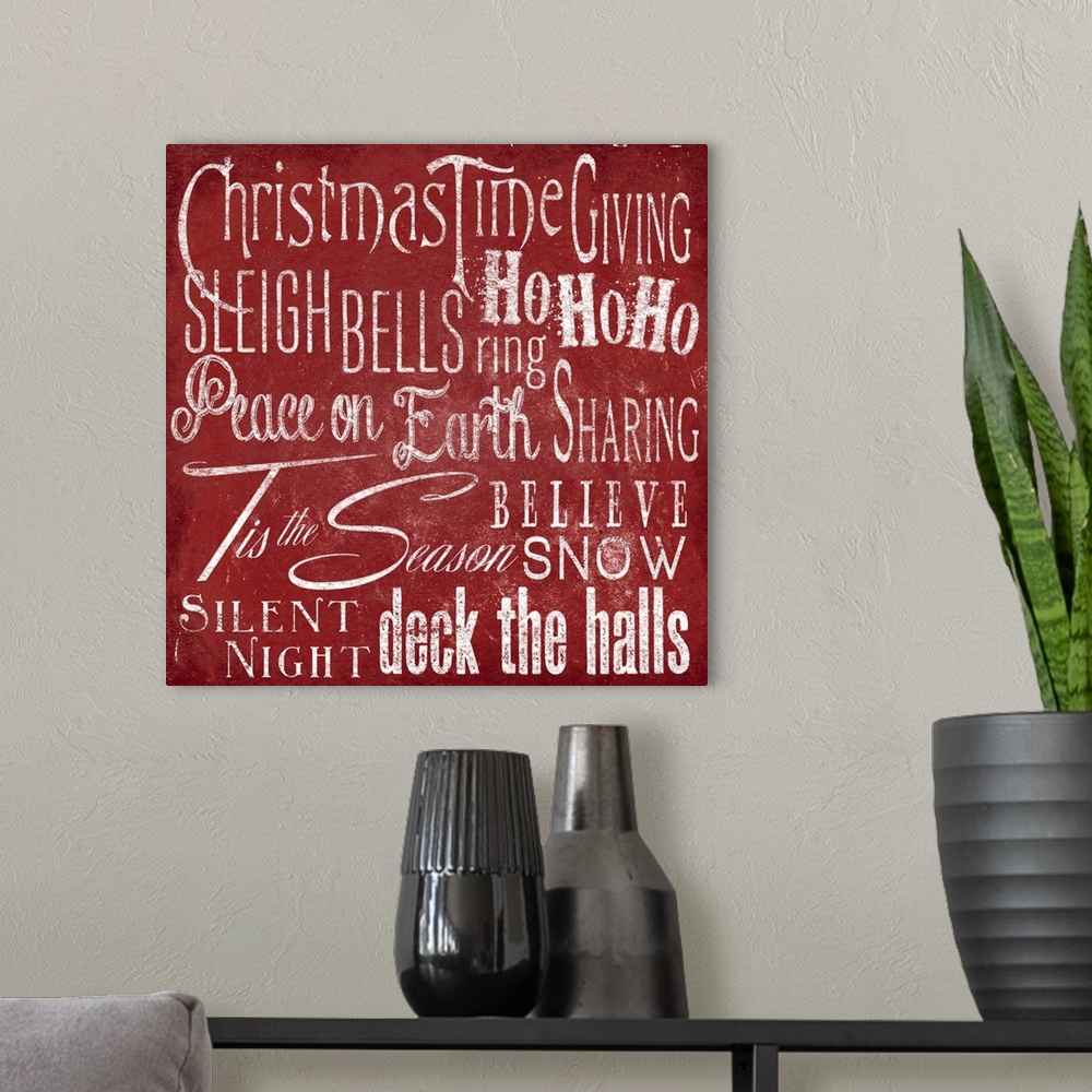 A modern room featuring Typography panel of Christmas-themed text, including carol lyrics and festive themes such as "Pea...