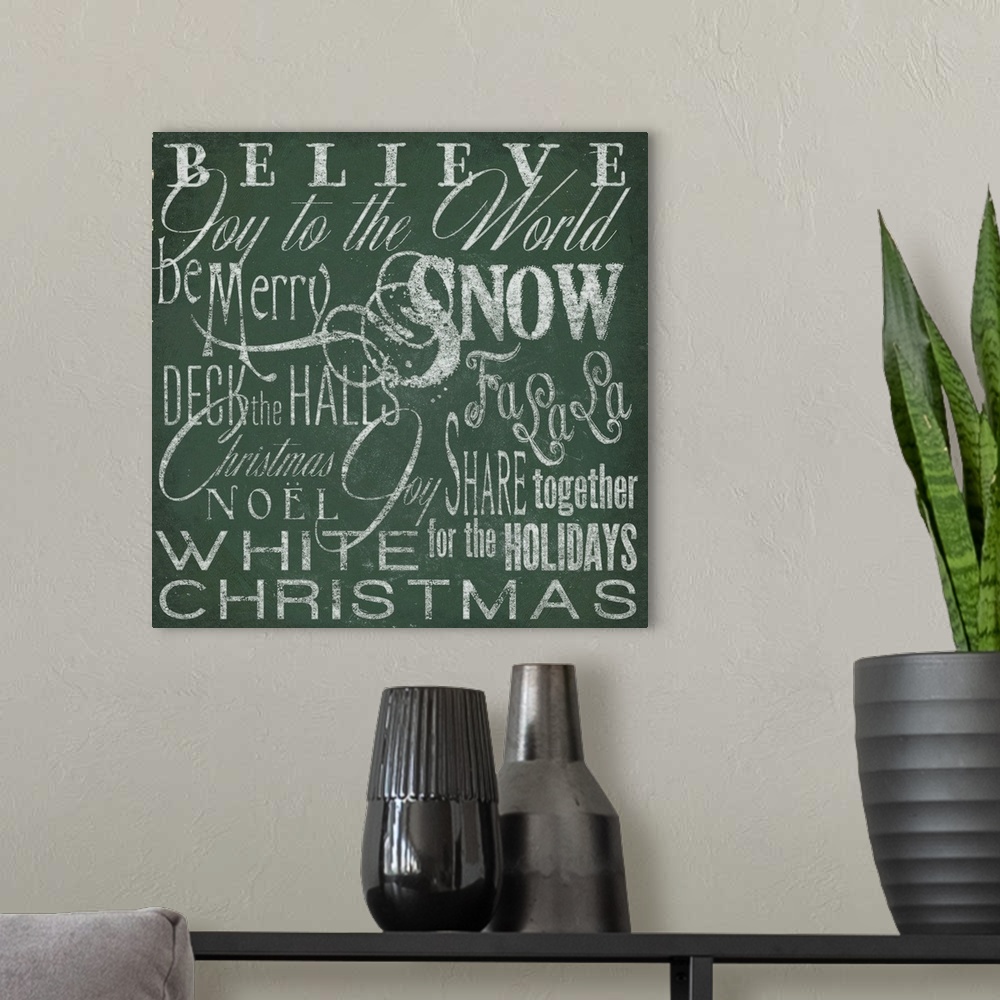 A modern room featuring Typography panel of Christmas-themed text, including carol lyrics and festive themes such as "Joy...