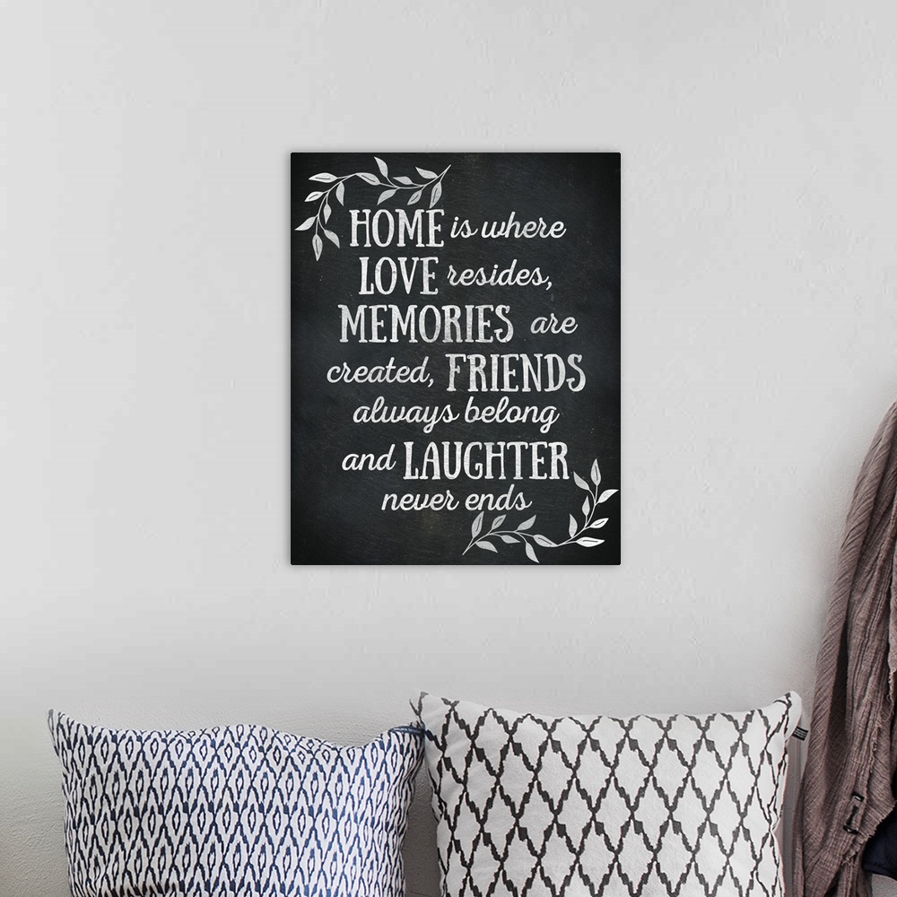 A bohemian room featuring Chalkboard sign that reads "Home is where Love resides, Memories are created, Friends always belo...