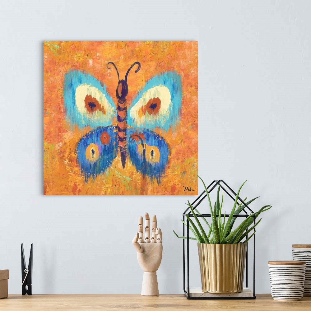 A bohemian room featuring Vivid painting of a butterfly with spotted wings on an orange background.