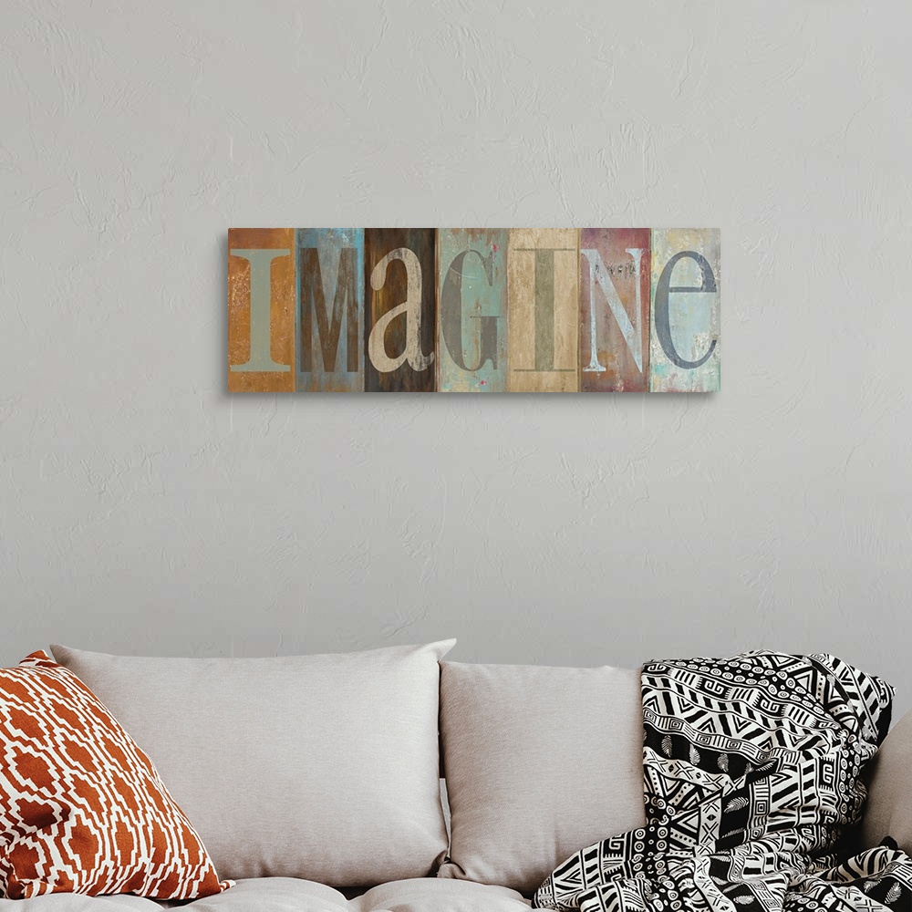 A bohemian room featuring Panoramic painting of the word "IMAGINE."  Each letter is within a vertically oriented rectangle ...