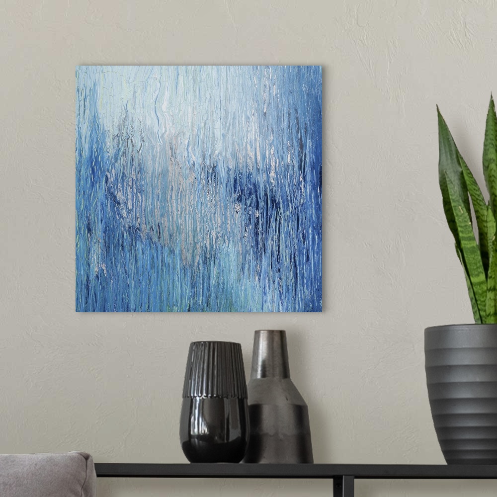 A modern room featuring Abstract artwork in shades of blue resembling glacial ice.