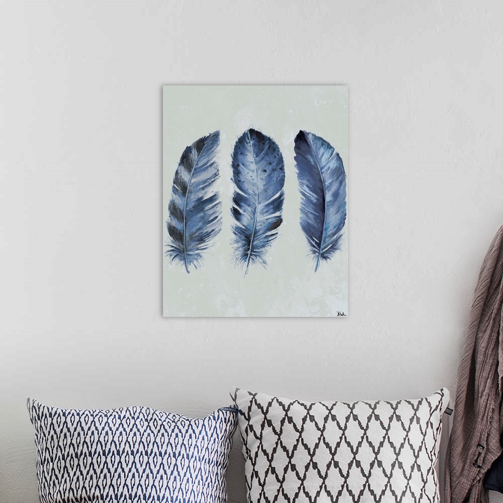 A bohemian room featuring Painting of three dark blue feathers of varying patterns.