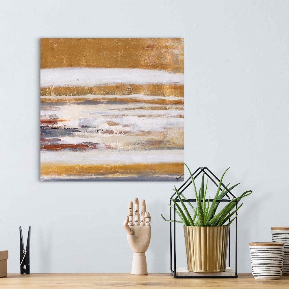 A bohemian room featuring Abstract artwork with golden textured layers.