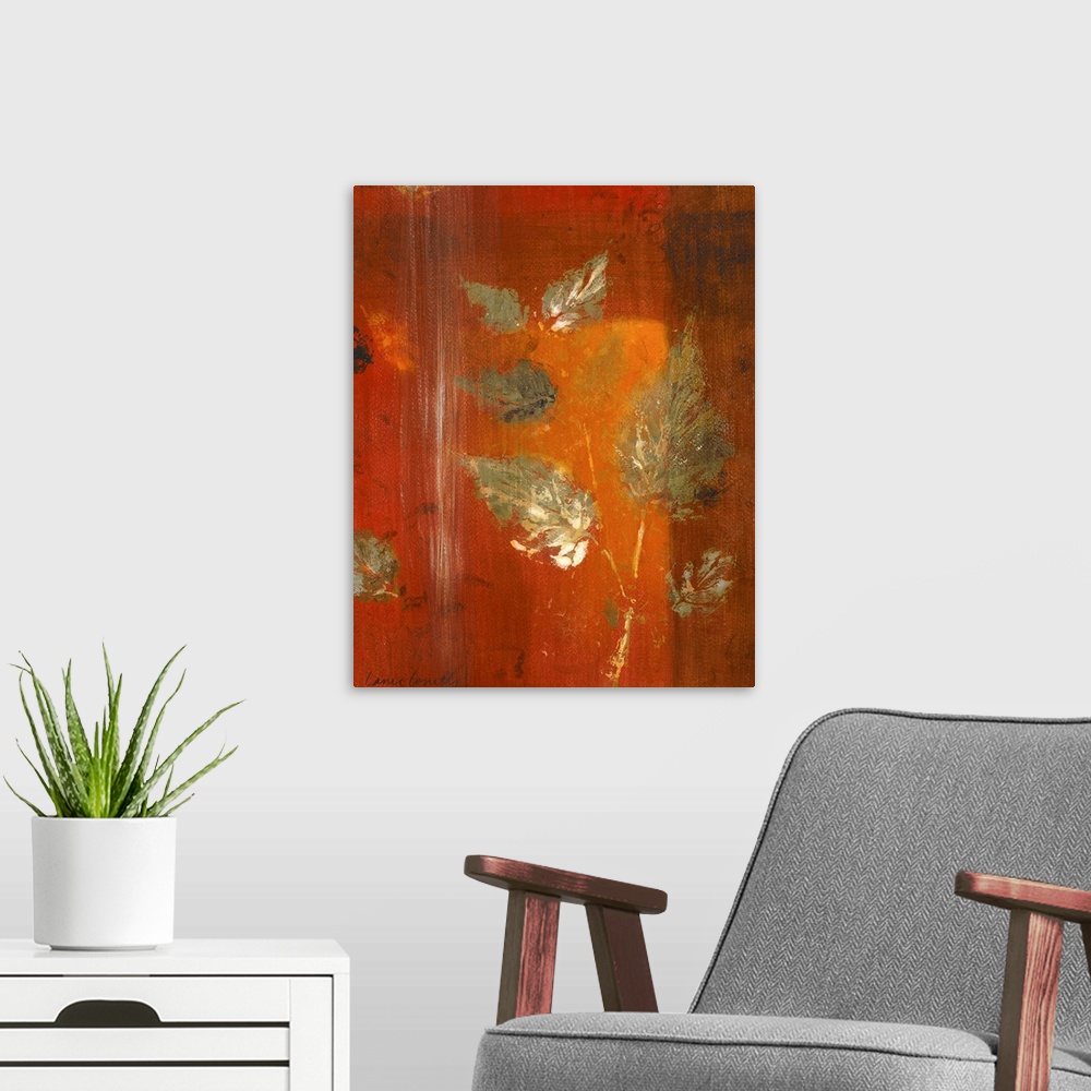 A modern room featuring Contemporary artwork in oranges and reds with leaf imprints.