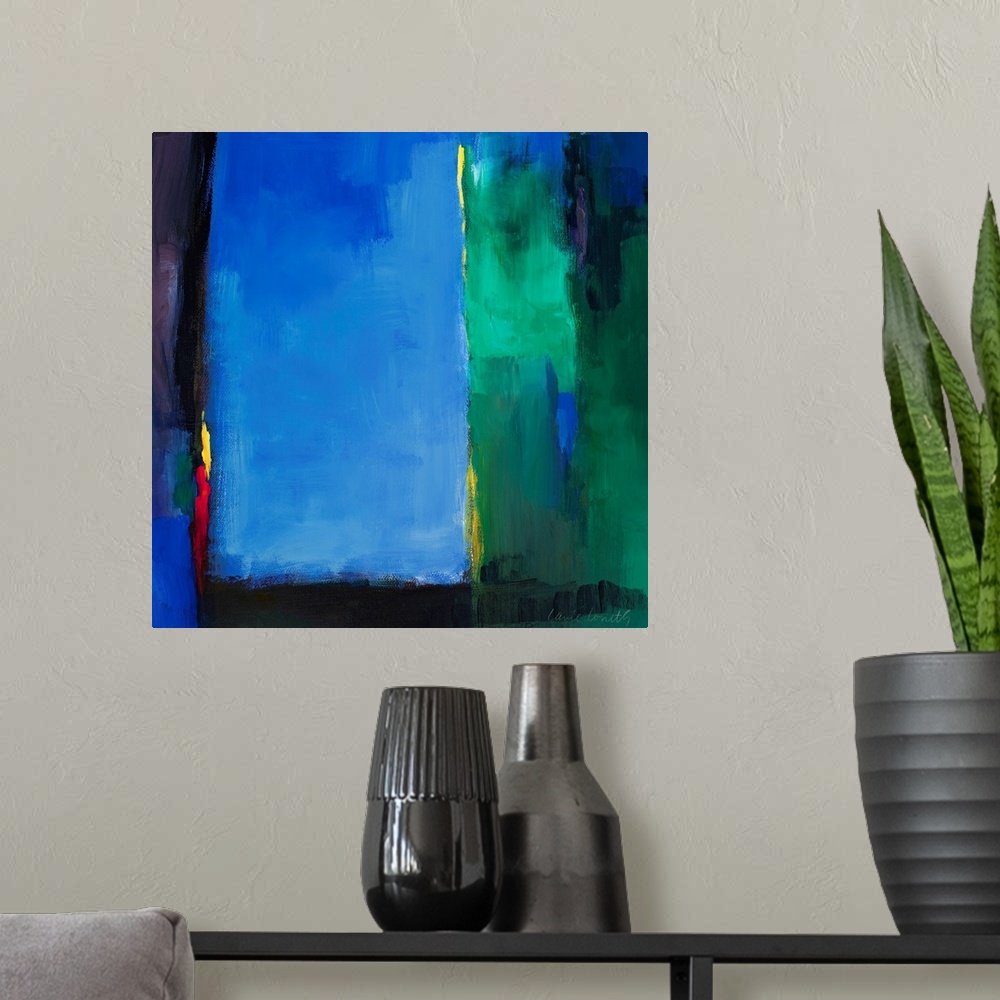 A modern room featuring Square abstract painting of brush strokes of various colors layered on top of each other.
