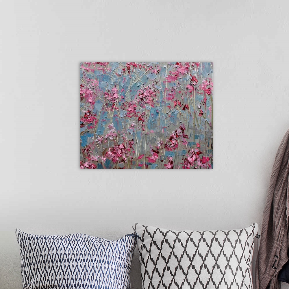 A bohemian room featuring Contemporary abstract painting resembling little red flowers against a blueish background.