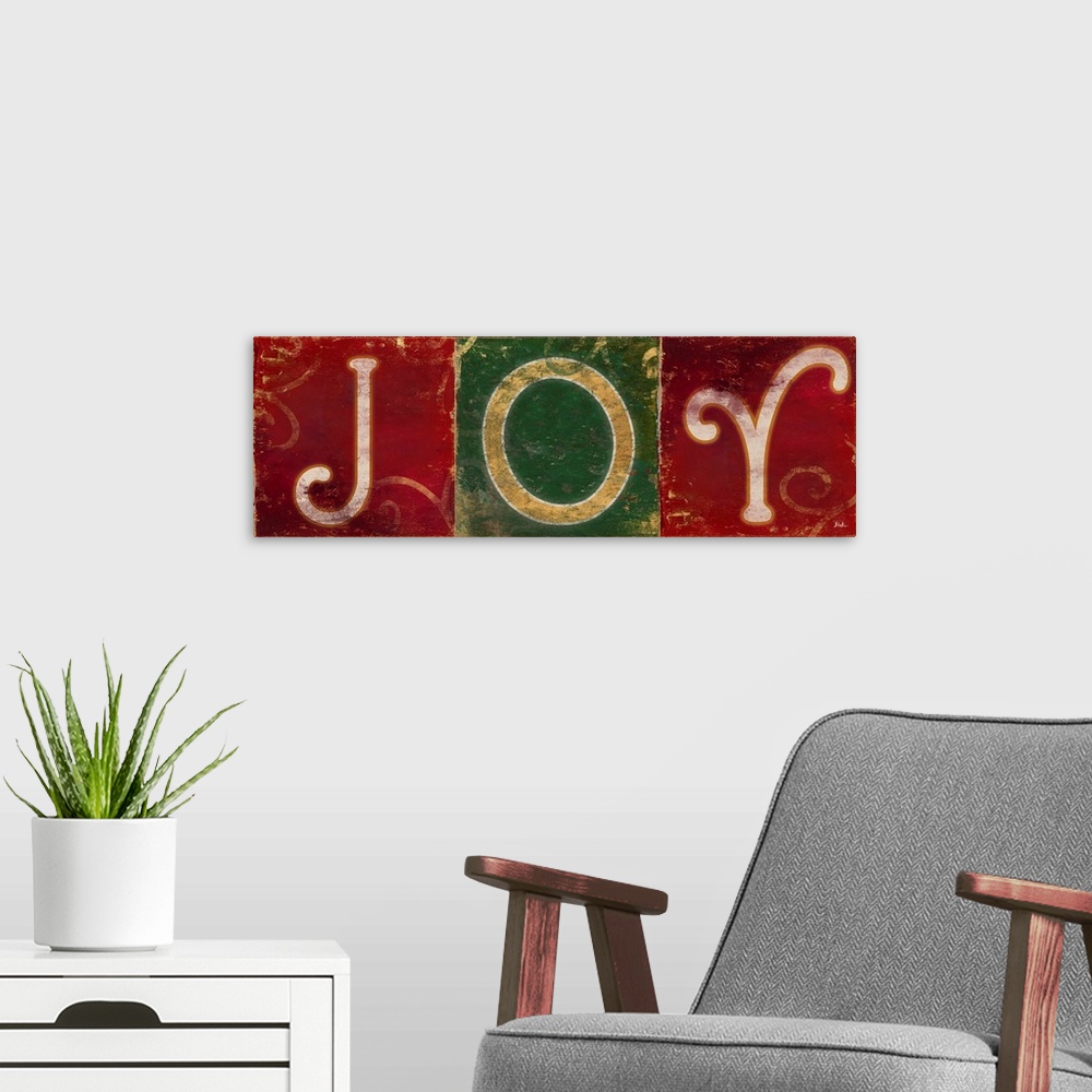 A modern room featuring Seasonal artwork of the word "Joy" in green and red squares.