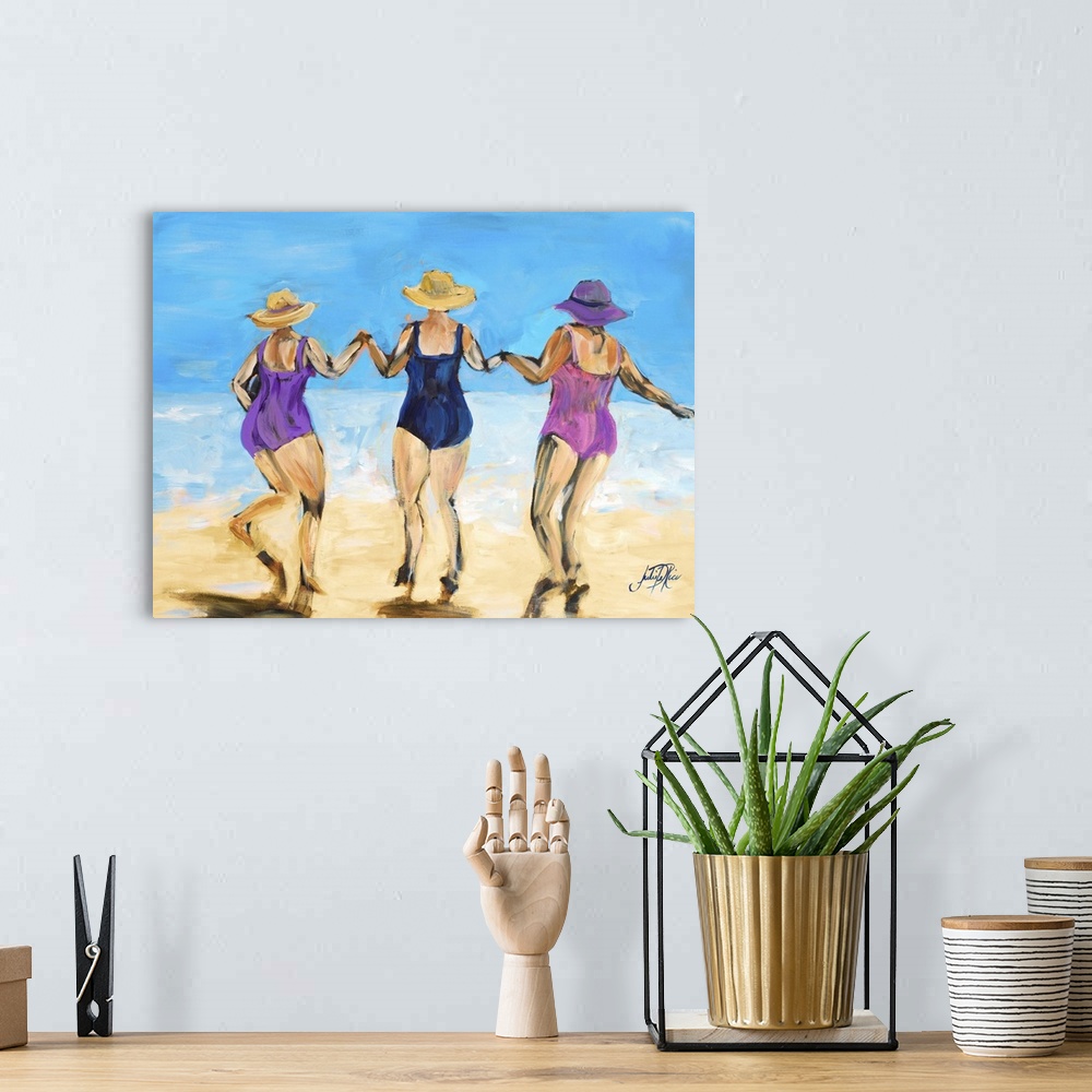 A bohemian room featuring Painting of three ladies in hats and swimsuits playing on the beach.