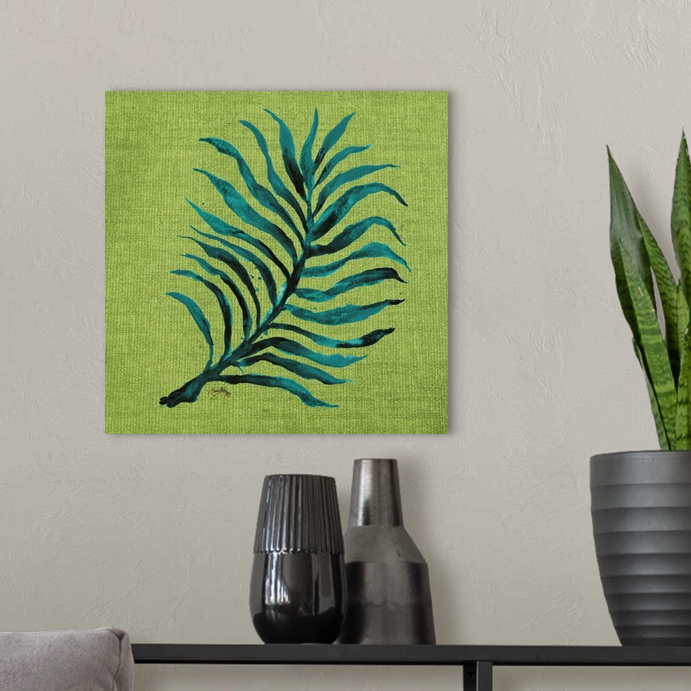 A modern room featuring Square watercolor painting of a blue-green palm leaf on a green burlap background.