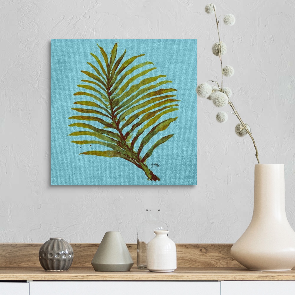 A farmhouse room featuring Square watercolor painting of a green palm leaf on a light blue burlap background.