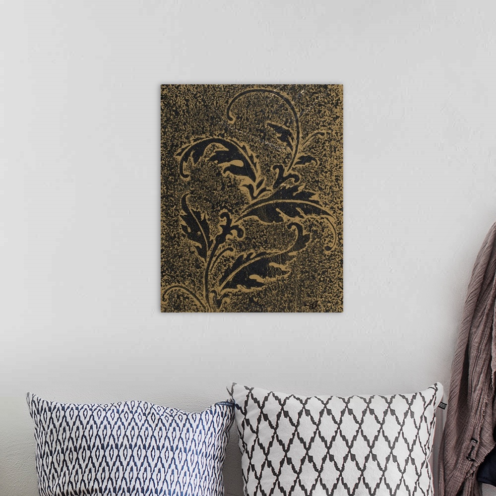 A bohemian room featuring Black and gold textured painting of a leaf silhouette.