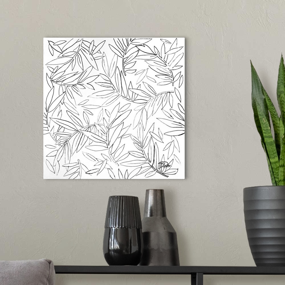 A modern room featuring A black and white sketch of leaves and branches.