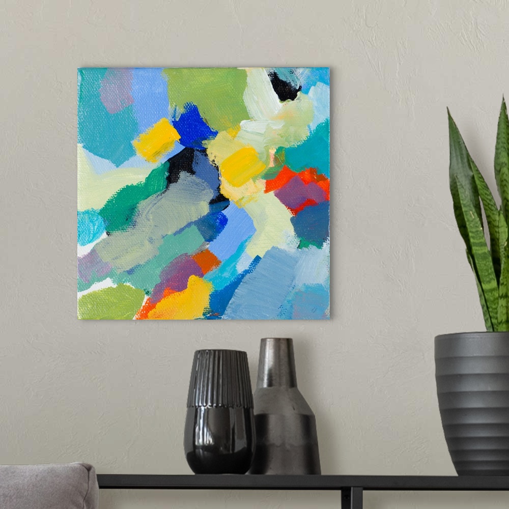 A modern room featuring This abstract artwork features bright blocks of color scattered in a energetic manner.