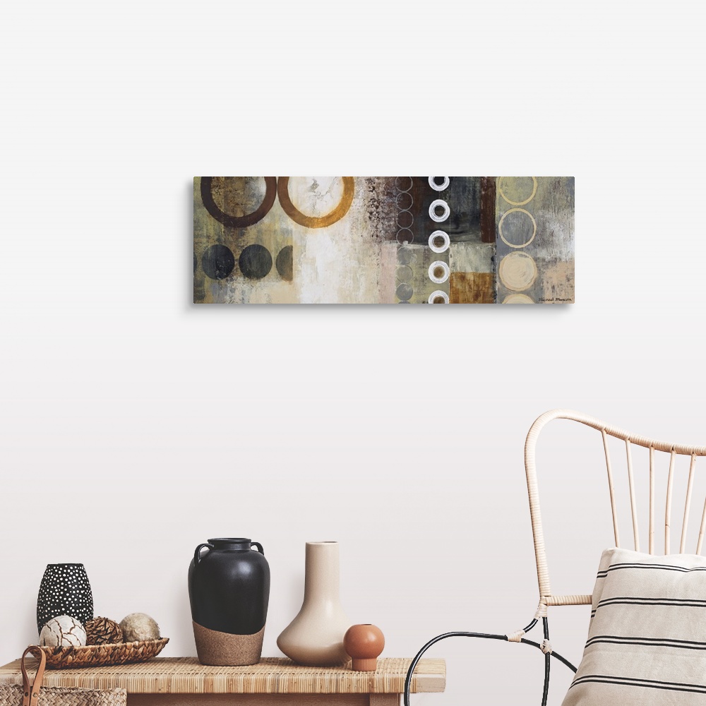 A farmhouse room featuring Panoramic abstract painting of different sized circles over top of a grungy background.