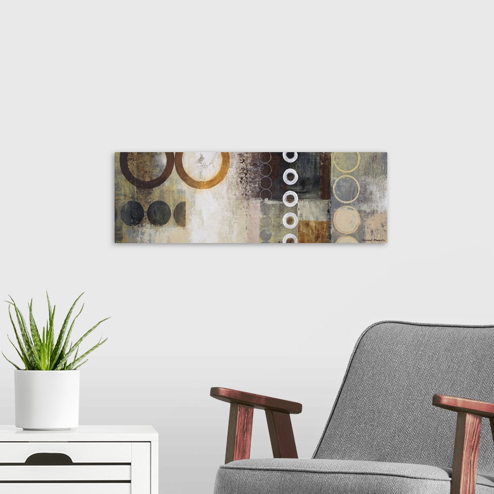 A modern room featuring Panoramic abstract painting of different sized circles over top of a grungy background.