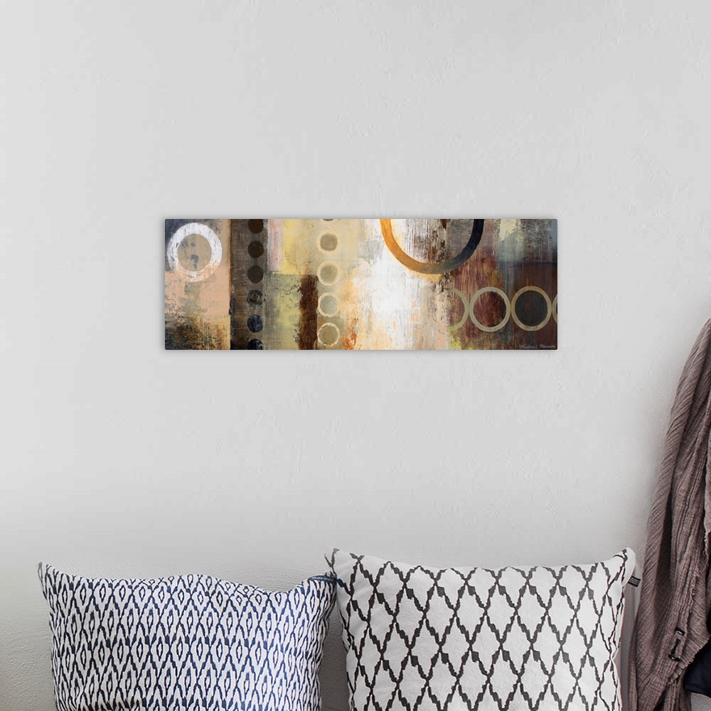 A bohemian room featuring Abstract artwork featuring multiple circular shapes in mostly neutral tones.