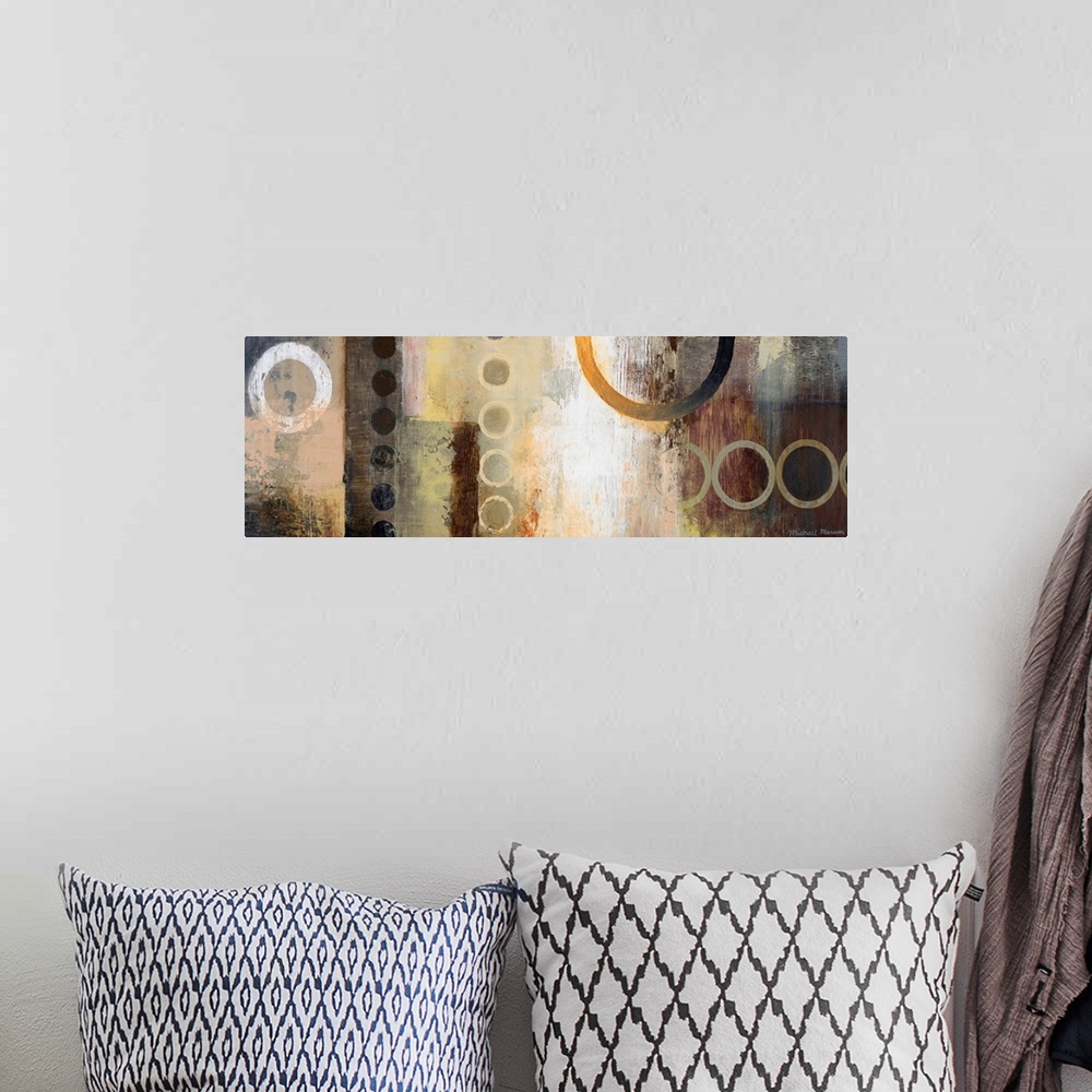 A bohemian room featuring Abstract artwork featuring multiple circular shapes in mostly neutral tones.