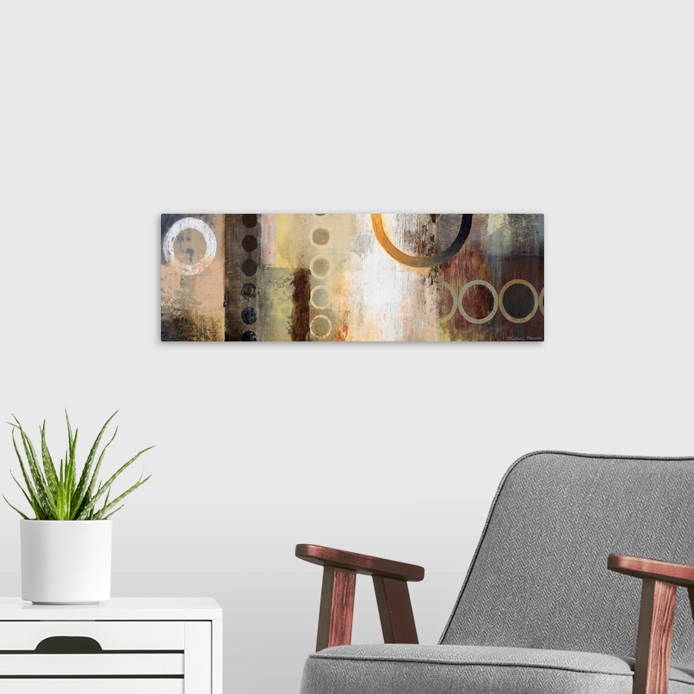 A modern room featuring Abstract artwork featuring multiple circular shapes in mostly neutral tones.