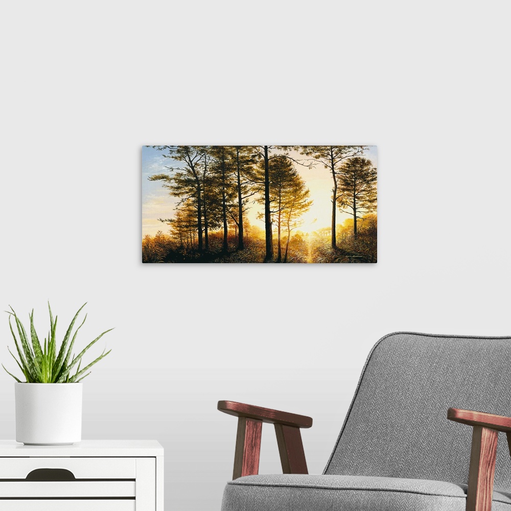 A modern room featuring A painting of the woods with a bright yellow sunrise.