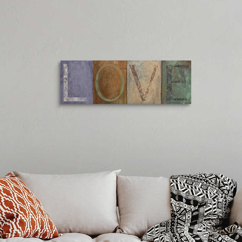 A bohemian room featuring Typographic panoramic painting of the word "LOVE."  Each letter is within a different colored squ...