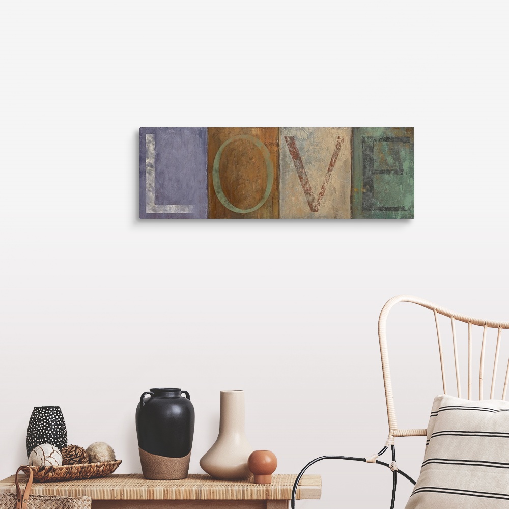 A farmhouse room featuring Typographic panoramic painting of the word "LOVE."  Each letter is within a different colored squ...