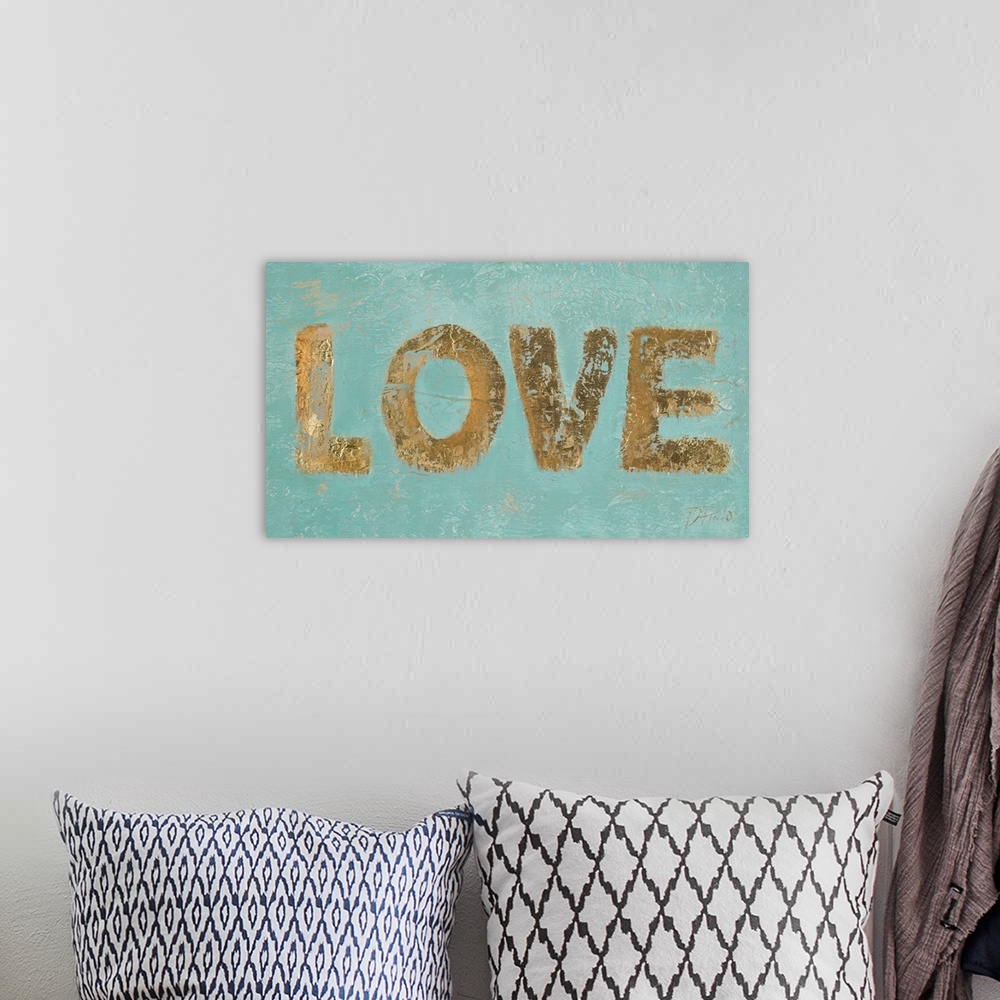 A bohemian room featuring "LOVE" n metallic gold on a teal textured background.