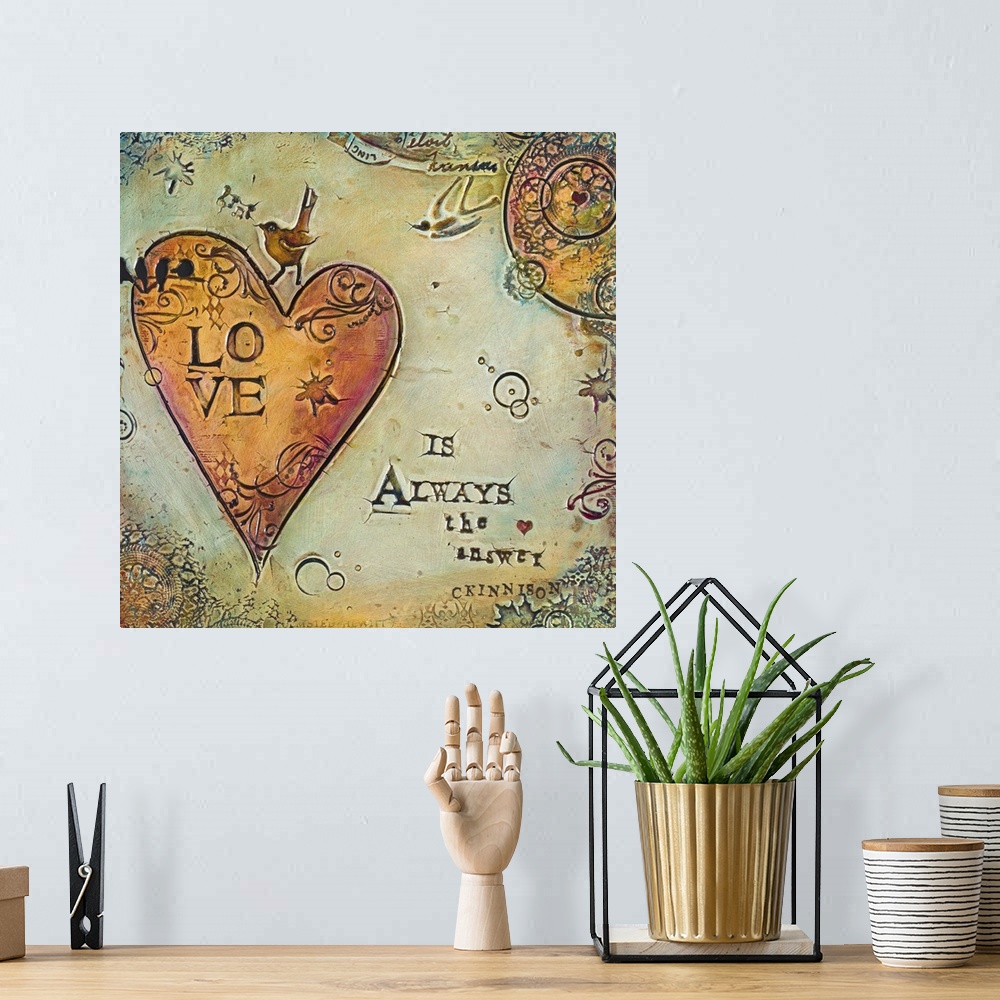 A bohemian room featuring A sentiment about love over a painting of a heart with curling shapes.