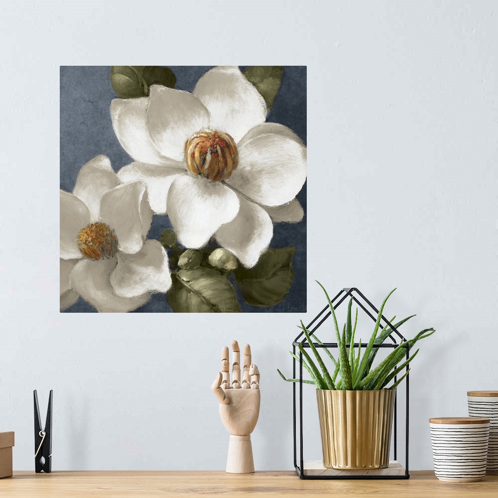 A bohemian room featuring Square floral painting of two fully bloomed magnolia flowers, surrounded by leaves, on a grey blu...