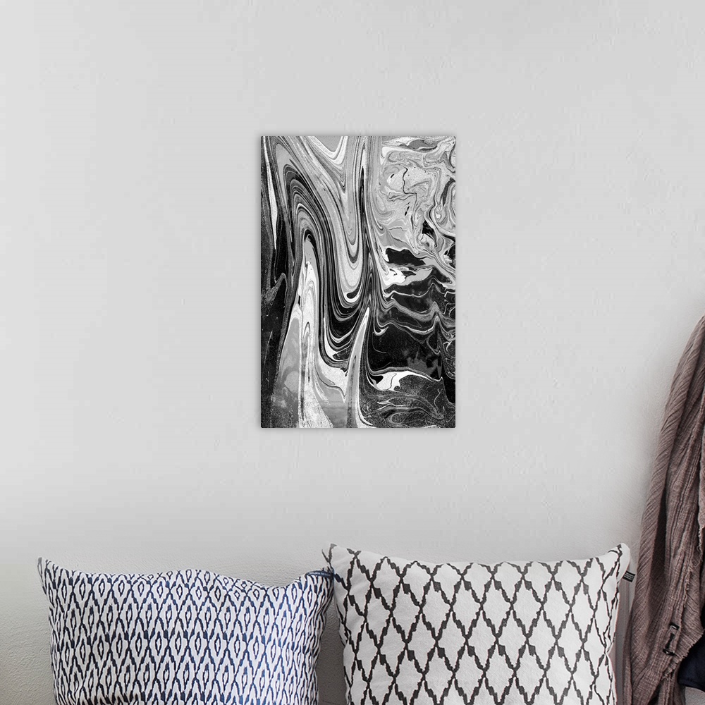 A bohemian room featuring Black and white marbled artwork.