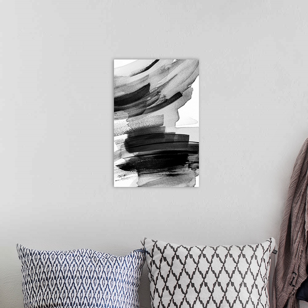 A bohemian room featuring This abstract artwork features layers of black brush strokes in expressive arcs.