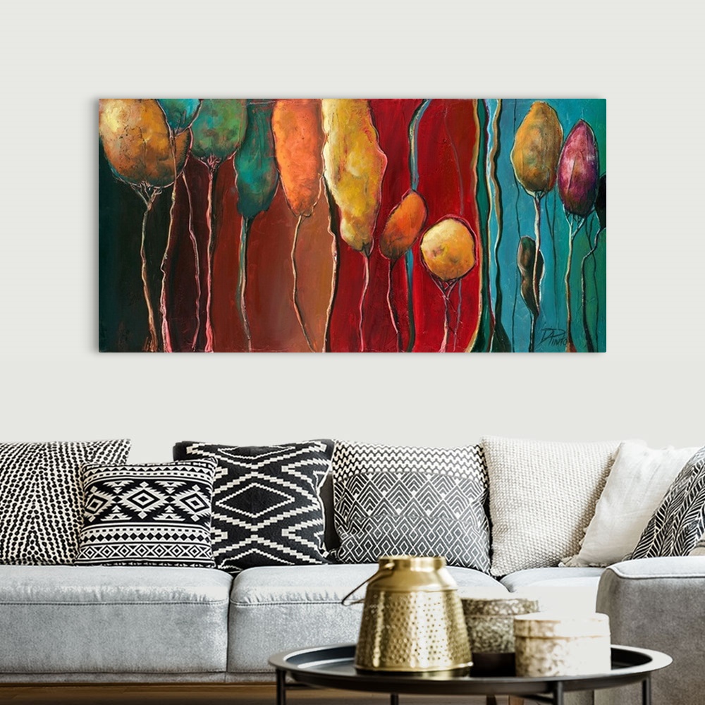 A bohemian room featuring A contemporary abstract painting of tall, skinny trees on a colorful background.