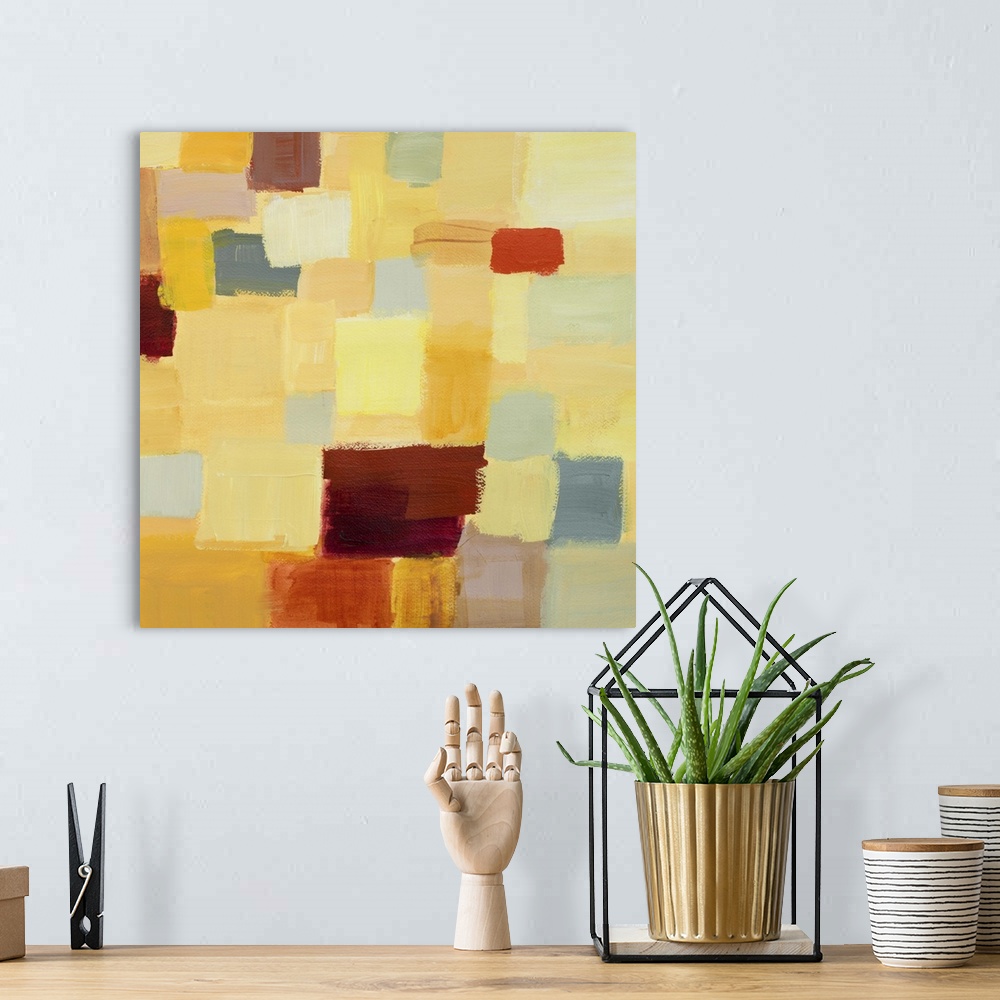 A bohemian room featuring Abstract painting made of colorful square shapes.