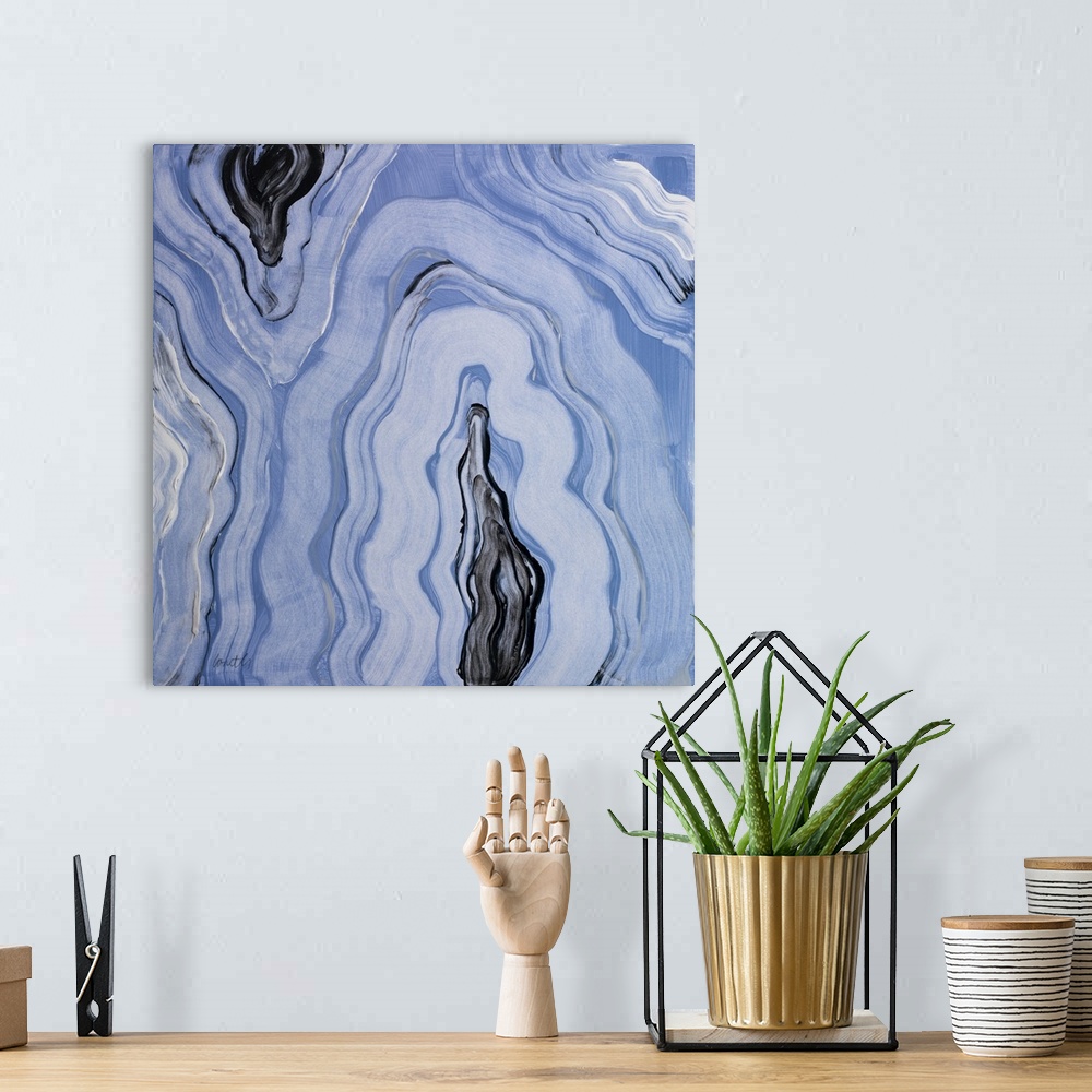 A bohemian room featuring Square abstract painting of agate in shades of blue with gray, black, and white.