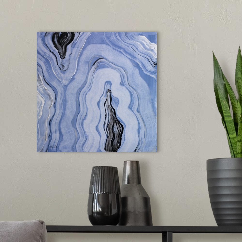 A modern room featuring Square abstract painting of agate in shades of blue with gray, black, and white.