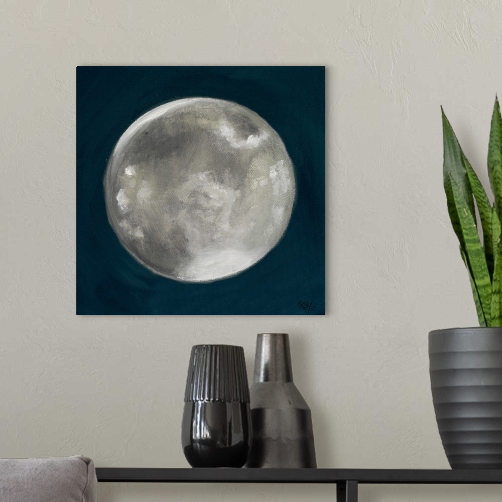 A modern room featuring Square painting of a full moon on a deep blue background.