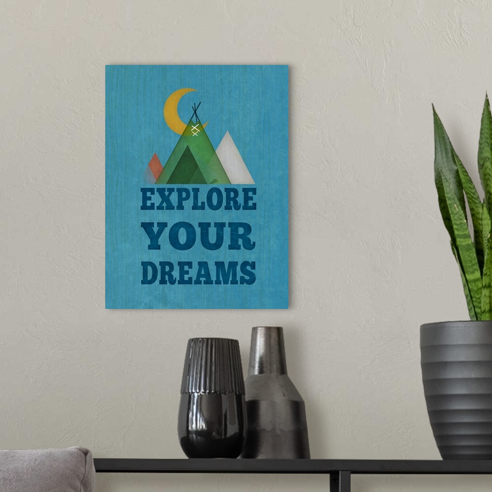 A modern room featuring Simple artwork of a crescent moon and a set of tents with "Explore your dreams."