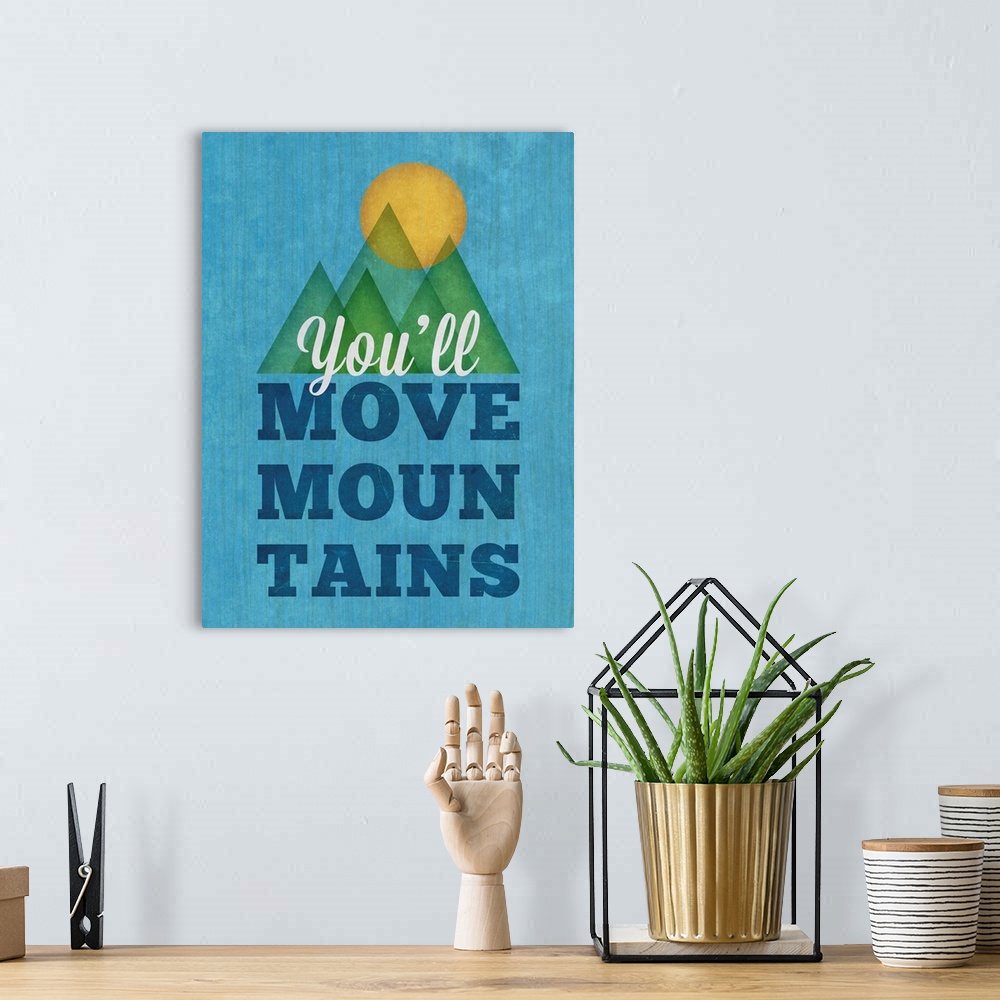 A bohemian room featuring Cute artwork of the sun over some mountains with "You'll move mountains."