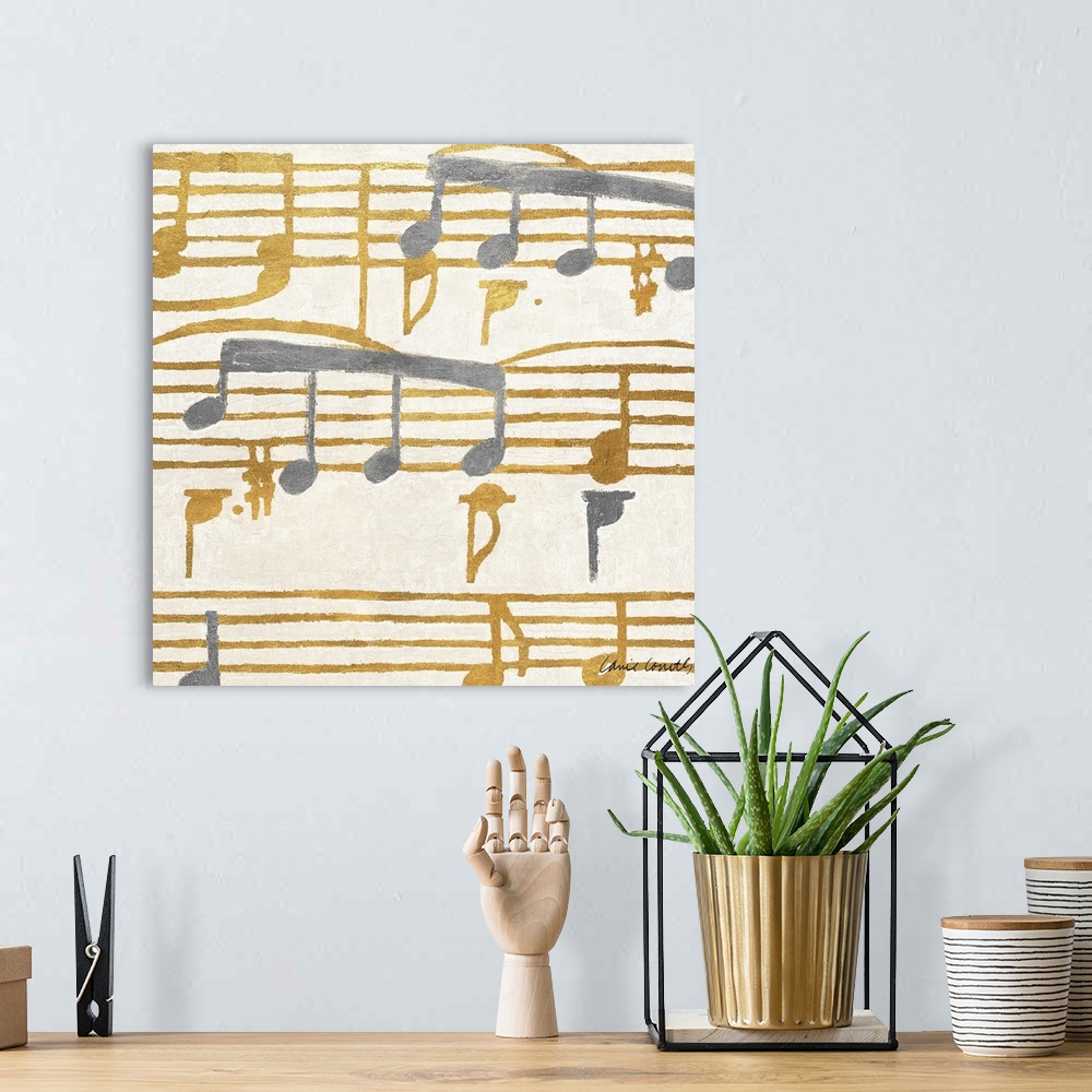 A bohemian room featuring Square painting of gold and silver music stanzas.