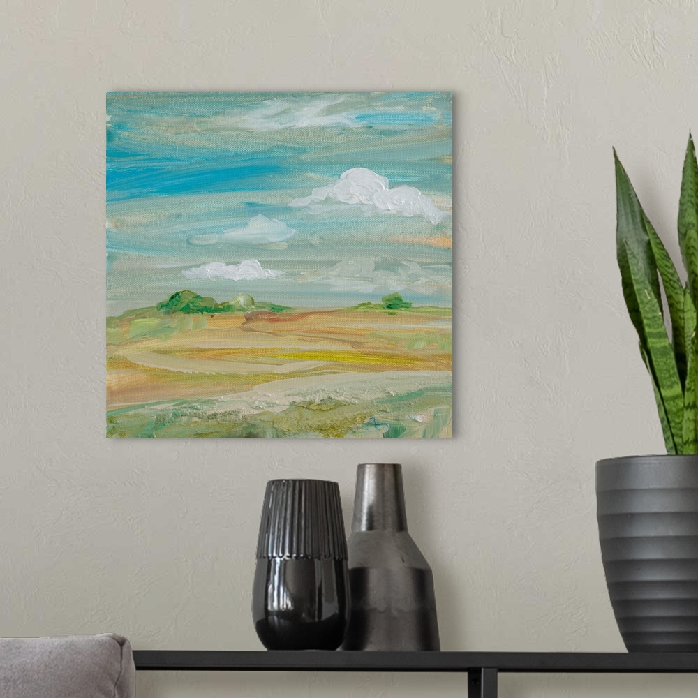 A modern room featuring Contemporary painting of a landscape under a cloudy sky.