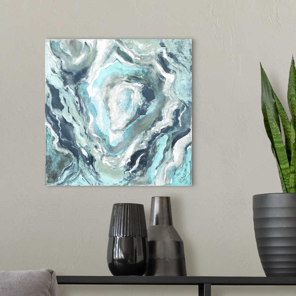 A modern room featuring Square abstract painting of quartz showing the agate in shades of blue and white.